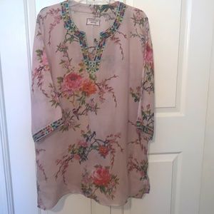Johnny was Tunic XL pink with flowers and a trim on the sleeves and neck line